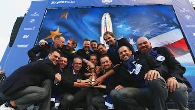 Europe team captain Paul McGinley poses with the Ryder Cup trophy and his team after the 2014 Ryder Cup on the PGA Centenary course at the Gleneagles Hotel on September 28, 2014 in Auchterarder, Scotland. Ross Kinnaird / Getty Images