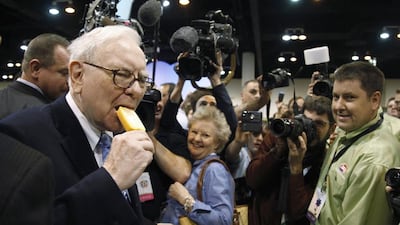 Berkshire Hathaway chairman Warren Buffett takes a bite of a Dairy Queen vanilla orange ice cream bar at the Berkshire Hathaway annual meeting in 2010. Rick Wilking / Reuters