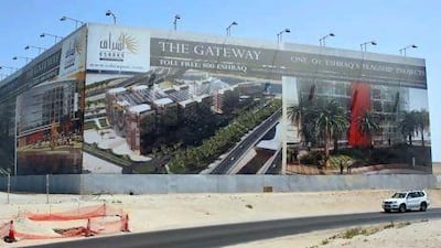 Billboards of projects by Eshraq Properties are displayed between the Maqta and Sheikh Zayed bridges in Abu Dhabi where the Gateway Toweres are planned.