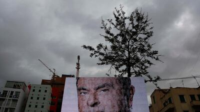 Poster showing former Nissan CEO Carlos Ghosn in Beirut, Lebanon. Many Lebanese have rallied around him. AP