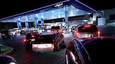 There were big queues at petrol stations last night, including this one in Manaseer, as the price rise approached.