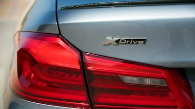 The xDrive badge denotes the car's all-wheel drive. Chris Whiteoak / The National