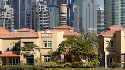 Villas in the Jumeirah Island in Dubai. Jumeirah Lake Towers are also seen in background. Keren Bobker explains the situation with property-related visas. Pawan Singh / The National