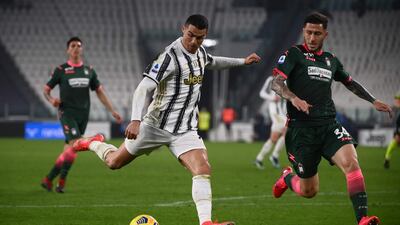 Juventus' Cristiano Ronaldo in action against Crotone's Luca Marrone. AFP