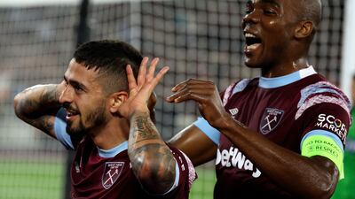 West Ham's Manuel Lanzini celebrates with West Ham's Angelo Ogbonna, right, after scoring his sides first goal during the Europa Conference League Group B soccer match between West Ham United and Silkeborg at the London stadium in London, England, Thursday, Oct. 27, 2022. (AP Photo / Ian Walton)