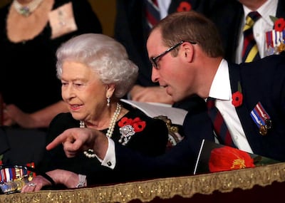 Queen Elizabeth II wearing the Bahrani pearl earrings, with Prince William at the annual Festival of Remembrance in November 2015. Reuters