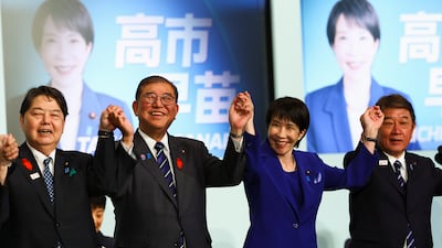 Newly elected leader of Japan's Liberal Democratic Party Sanae Takaichi celebrates with Prime Minister Shigeru Ishiba and other candidates after winning the LDP leadership election in Tokyo on Saturday. EPA