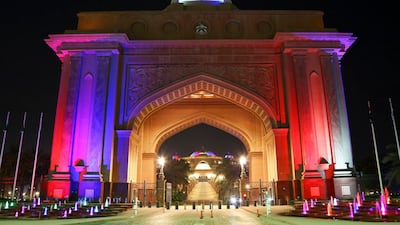 The entrance of the Emirates Palace hotel in Abu Dhabi is lit up in US flag's colours on Sunday to mark the country's Independence Day.