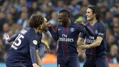Paris Saint-Germain players celebrate after Blaise Matuidi, centre, scored against Marseille at the Velodrome Stadium, in Marseille, southern France, Sunday, February 26, 2017. Claude Paris / AP Photo