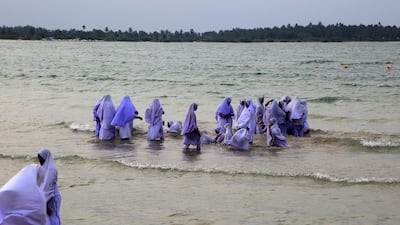 Muslim girls bathing in their clothes, Pasikudah Bay, Eastern Province, Sri Lanka. Getty Images
