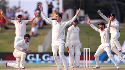 Mitchell Santner appeals successfully after teammate Tom Latham (L) took a catch to dismiss England's Jack Leach during the fourth day of the first Test between England and New Zealand at Bay Oval. AFP