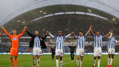 Huddersfield Town players salute the crowd after their Premier League win over Manchester United. Ed Sykes / Reuters