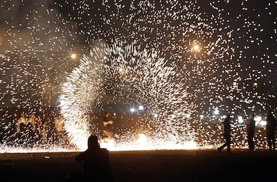 Iranians take part in Nowruz traditions in Tehran on March 14, 2023. This year's celebrations have been overshadowed by war. EPA