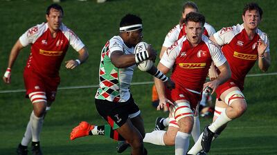Emosi Vecanuau makes a run for Abu Dhabi Harlequins during their 27-5 win over Bahrain on Friday. Satish Kumar for The National