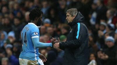 Manchester City manager Manuel Pellegrini shakes Wilfried Bony's hand after the team's Premier League win on Saturday. Nigel Roddis / EPA / December 12, 2015