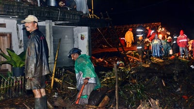 Relief efforts were hampered by blocked roads covered with thick mud and debris. AP Photo