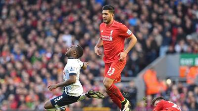 Tottenham defender Danny Rose, left, is tackled by Liverpool midfielder Adam Lallana. Paul Ellis / AFP