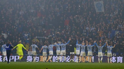 Huddersfield Town's players celebrate their first win of the 2018/19 season, as well as scoring at home for the first time since April. Peter Powell / EPA