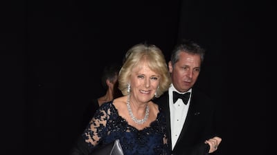 The queen consort wearing a black and navy lace gown for a reception for supporters of The British Asian Trust at Natural History Museum on February 2, 2016 in London. Getty Images