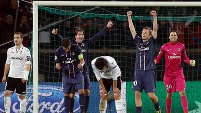 Paris Saint-Germain players celebrate after their win over Valencia in the Champions League.