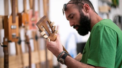 Guitars made from cigar boxes by Howlin' Rooster. Reem Mohammed / The National