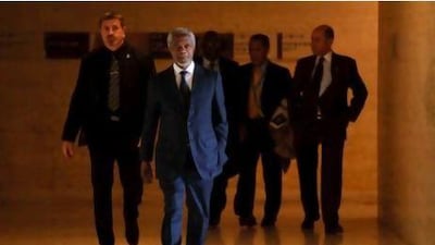 United Nations-Arab League envoy Kofi Annan (C) leaves with his staff on April 4, 2012 the United Nations offices in Geneva. Fierce clashes erupted after Syria's regime sent reinforcements into rebel areas despite a truce pledge, as the UN said it was rushing a team to Damascus to pave the way for peace monitors. AFP PHOTO / FABRICE COFFRINI *** Local Caption *** 238364-01-08.jpg