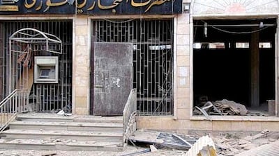 A branch of the Syrian Commercial Bank is destroyed in clashes at Marat Al Numan, near the northern province of Idlib. Shaam News Network / Reuters