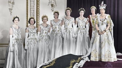 HM Queen Elizabeth II with her maids of honour in the Green Drawing Room, Buckingham Palace, at her coronation on June 2, 1953. In selecting six maids, instead of pages, to bear her velvet train throughout the coronation ceremony, the Queen followed the precedent of Queen Victoria. Getty Images