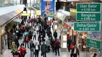 Passengers walk through Berlin's Tegel airport. The International Air Transport Association will open its annual general meeting in Cape Town, South Africa, today. Adam Berry / Getty Images