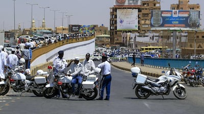 Sudanese security forces stand guard at the cordoned-off site of an assassination attempt against Sudan's Prime Minister Abdalla Hamdok, who survived the attack with explosives unharmed, in the capital Khartoum. AFP