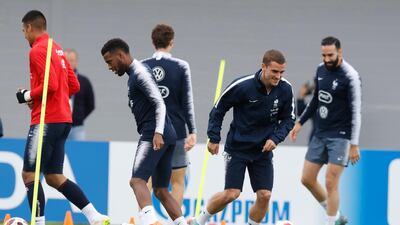France's Antoine Griezmann smiles as he warms up during a training session at the 2018 soccer World Cup in Glebovets, Russia, Wednesday, July 4, 2018. (AP Photo/David Vincent)