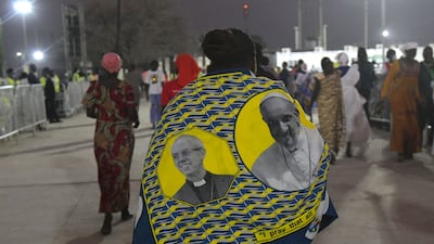 A scarf bearing the faces of the Archbishop of Canterbury Justin Welby, left, and Pope Francis. AFP