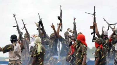Fighters with the Movement for the Emancipation of the Niger Delta (MEND) raise their riffles to celebrate news of a successful operation by their colleagues against the Nigerian army in the Niger Delta.