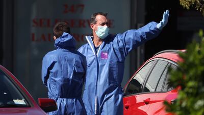 Police forensic staff prepare and head into Countdown Lynn Mall in Auckland. Getty Images