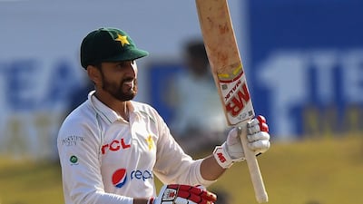 Pakistan's Agha Salman celebrates after reaching his fifty. AFP