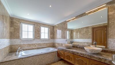 The classic villa comes with marble and wood finishing in the bathroom. Courtesy LuxuryProperty.com