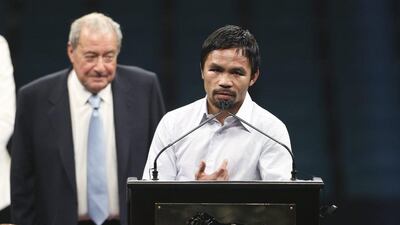 Manny Pacquiao addresses the media following his defeat to Floyd Mayweather. Stringer / EPA
