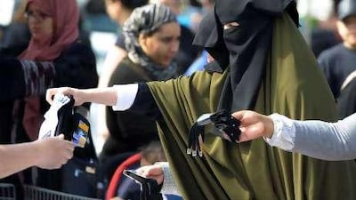 France is debating whether to ban the veil. Above, a market near Lyon, eastern France.
