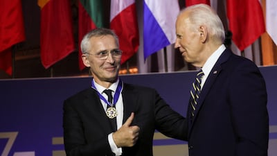 Mr Biden awards Mr Stoltenberg with the Presidential Medal of Freedom. Reuters