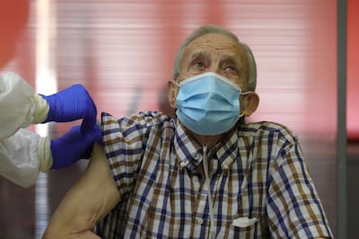 Nicanor, 72, a nursing home resident, became the first person to receive the vaccine in Madrid. EPA