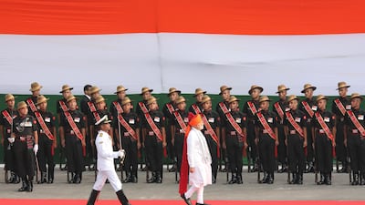 Mr. Modi inspects an honor guard at the Red Fort. EPA