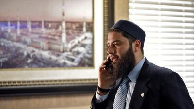 Hassan Shibly, lawyer for Hoda Muthana, the Alabama woman who left home to join ISIS, speaks on a phone in Tampa Florida, February 20, 2019. AP