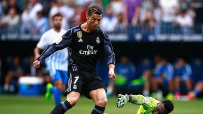Cristiano Ronaldo of Real Madrid scores his sides first goal against Malaga at La Rosaleda Stadium on May 21, 2017 in Malaga, Spain. Gonzalo Arroyo Moreno / Getty Images