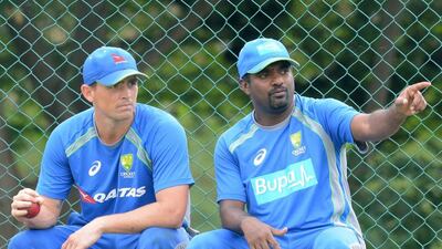 Australia's bowling consultant, former Sri Lanka cricketer Muttiah Muralitharan speaks with Australian spinner Stephen O'Keefe ahead of the Test series. Lakruwan Wanniarachchi / AFP / July 26, 2016