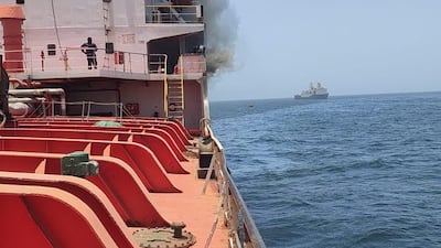 Smoke billows from the tanker, which the US has accused of breaching its blockade of Iranian ports