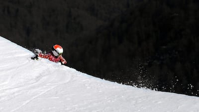 Canada's Brady Leman falls off a jump after crashing in the men's ski cross final at the Rosa Khutor Extreme Park on February 20, 2014, in Krasnaya Polyana, Russia. Sergei Grits / AP Photo
