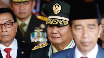 Prabowo Subianto, centre, is expected to continue Joko Widodo's policies when he takes over as President of Indonesia later this year. EPA