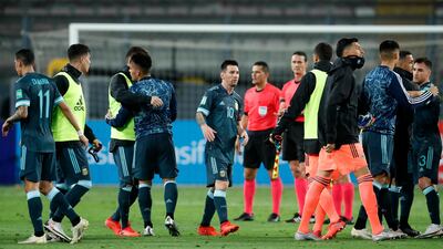 Lionel Messi of Argentina celebrates with teammates after winning a match. Getty Images
