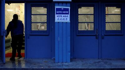A person arrives as early morning voting opens for the midterm election at PS 140 in Manhattan, New York City, US. Reuters