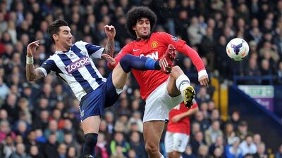Centre midfield: Marouane Fellaini, Manchester United. Produced his most assured performance in a United shirt as he ran the midfield against West Brom. Paul Ellis / AFP